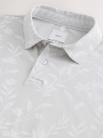 Tricou de la Next pe gri
