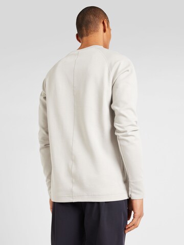 Sweat-shirt 'TECH' Nike Sportswear en gris