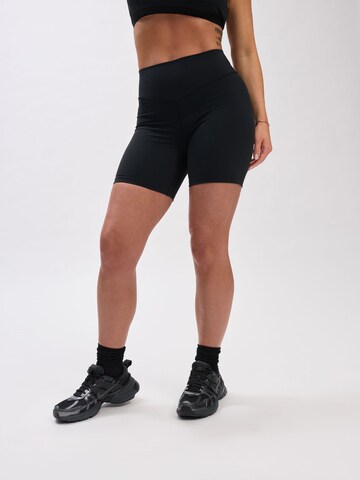 V!BE STUD!OS Skinny Leggings in Black: front