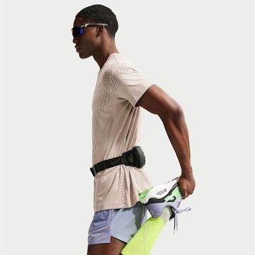 NIKE Regular Workout Pants 'Stride Nvlty' in Purple