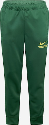 Nike Sportswear Tapered Pants in Green: front