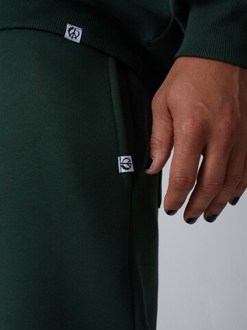 ABOUT YOU x Benny Cristo Regular Trousers 'Keno' in Green