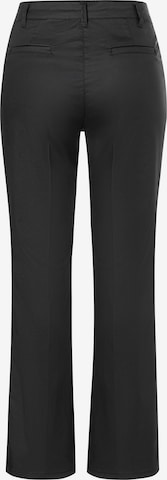 Flared Pantaloni con piega frontale di MORE & MORE in nero