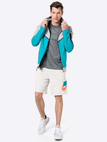 Nike Sportswear Normální Kalhoty 'Alumni' – šedá