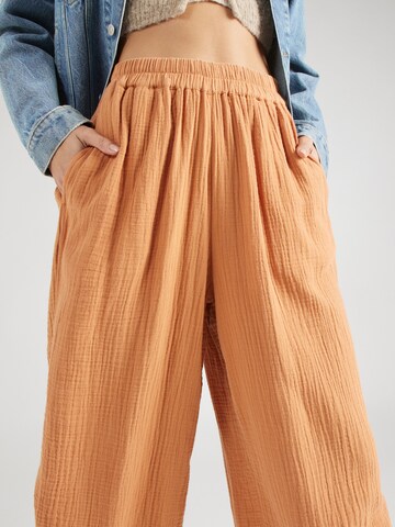 BILLABONG Szeroka nogawka Spodnie 'FOLLOW ME' w kolorze pomarańczowy