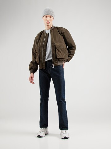 Embassy of Bricks and Logs Between-Season Jacket 'MAPES' in Green