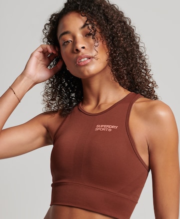 Bustier Soutien-gorge de sport Superdry en marron : devant