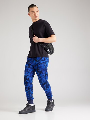 mėlyna Nike Sportswear Siaurėjantis Kelnės 'TCH FLC'