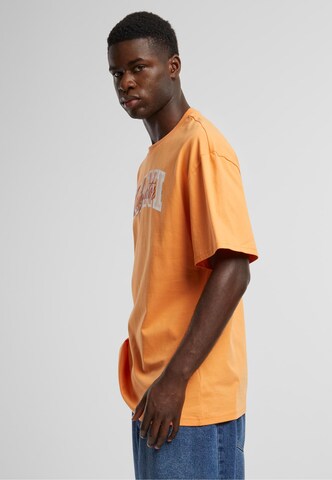 T-Shirt 'Serif Originator' Karl Kani en orange