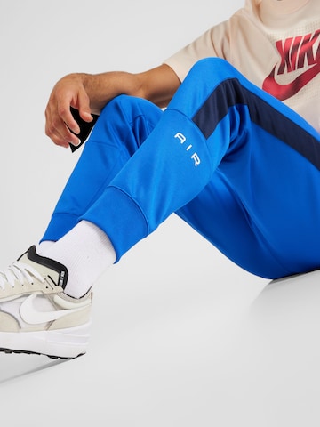 Regular Pantaloni sport 'AIR' de la Nike Sportswear pe albastru