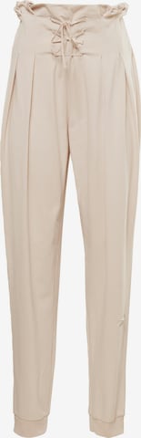 Coupe slim Pantalon de sport Reebok en beige : devant