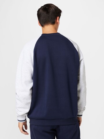 ADIDAS ORIGINALS Sweatshirt 'Varsity' i blå