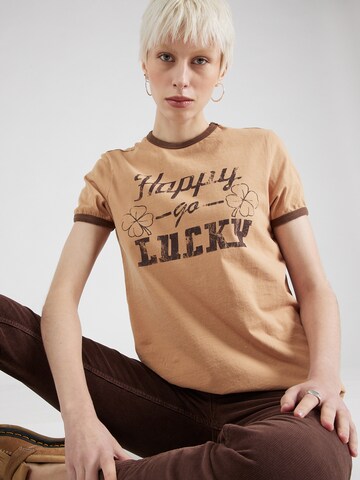 BDG Urban Outfitters Tričko 'HAPPY GO LCKY' - Béžová