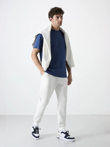 Tommy Life - Skinny Calças de desporto 'Jogginghose' em branco