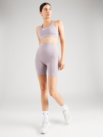 Skinny Pantaloni sportivi di NIKE in lilla