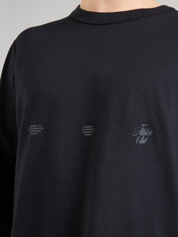 NIKE Koszulka funkcyjna 'Primary' w kolorze czarny