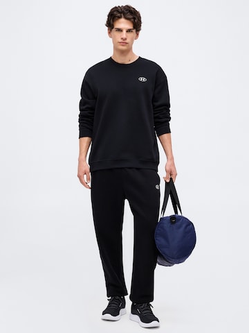 UNDER ARMOUR Regularen Športne hlače 'Rival' | črna barva