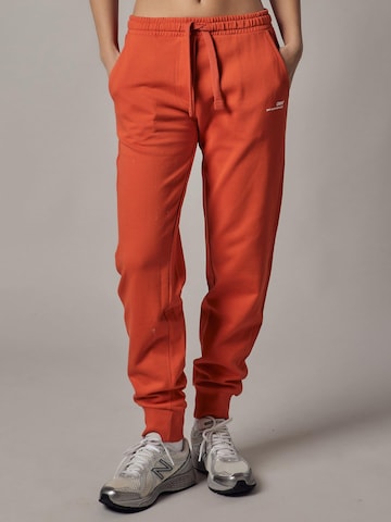 Pantaloni di OWN Off With Nature in arancione: frontale