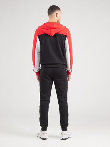 Tuta da jogging di Champion Authentic Athletic Apparel in rosso