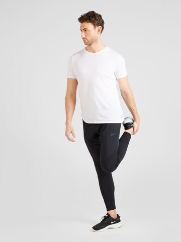 Regular Pantalon de sport NIKE en noir