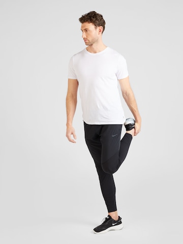 NIKE Regularen Športne hlače | črna barva