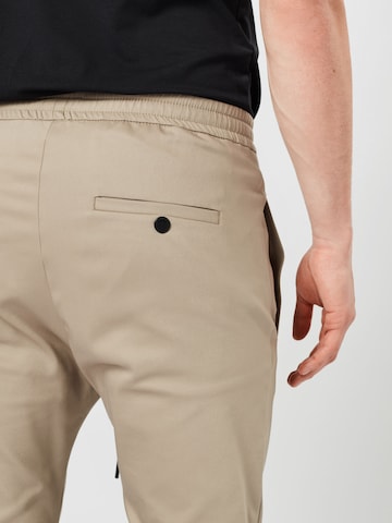 DRYKORN Slim fit Trousers 'Jeger' in Brown