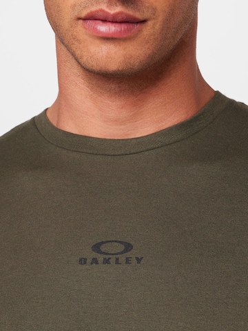 žalia OAKLEY Sportiniai marškinėliai 'BARK'