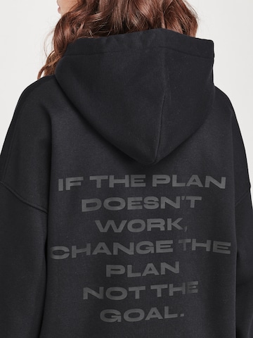 ABOUT YOU x VIAM Studio Hoodie 'Better' in Schwarz