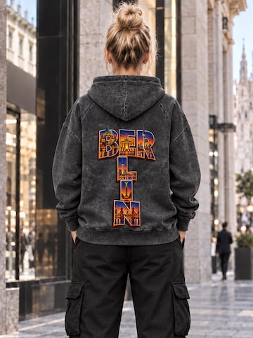 LUNØIR StudioSweater majica 'Berlin City Lights – Vermilion' - crna boja