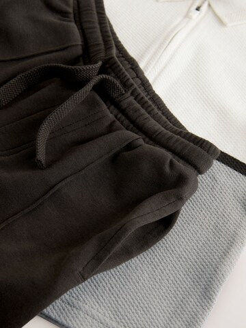 Set Next en gris