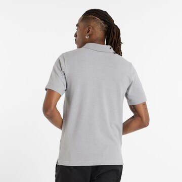 new balance Poloshirt in Grau