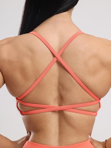 neverover Korzetová Sportovní podprsenka 'Hue Cross-Back Strappy Bra' – oranžová