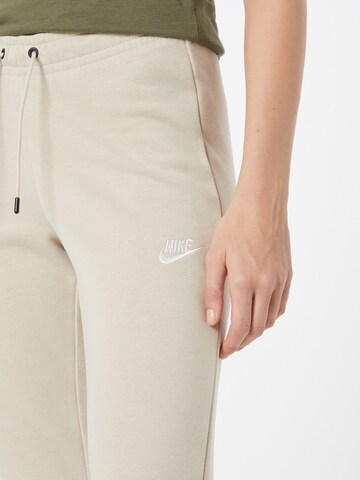 Nike Sportswear Tapered Trousers 'W NSW ESSNTL PANT TIGHT FLC' in Beige