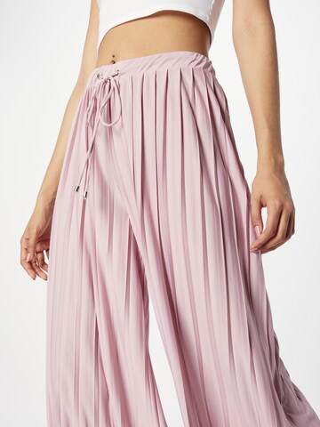 ABOUT YOU Wide leg Trousers 'Caren' in Pink