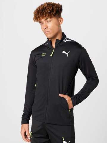 PUMA - Chaqueta de chándal en negro: frente