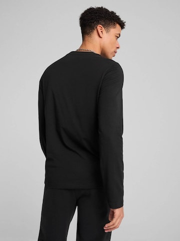 PUMA Shirt‌‌‌‌‌‌‌‌‌ in Schwarz