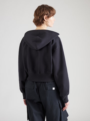 Nike Sportswear Collegetakki 'PHNX FLC' värissä musta