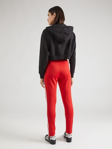 ADIDAS ORIGINALS Slim fit Trousers 'Adicolor Sst' in Red