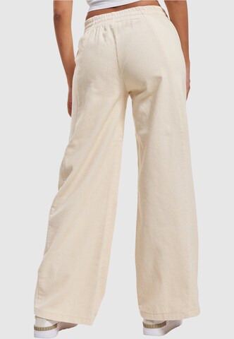 Wide leg Pantaloni di Karl Kani in beige