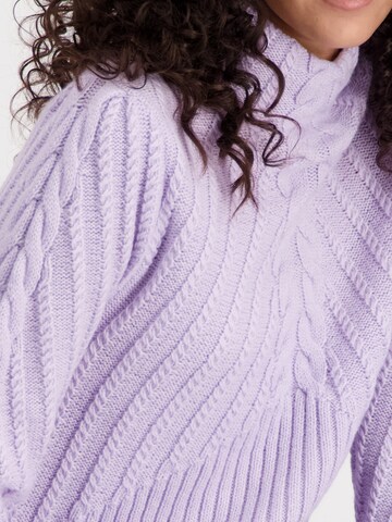 purpurinė monari Megztinis