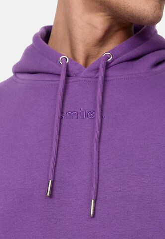 Sweat-shirt smiler. en violet