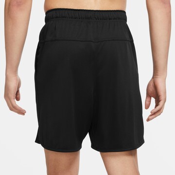 NIKE Regular Workout Pants in Black