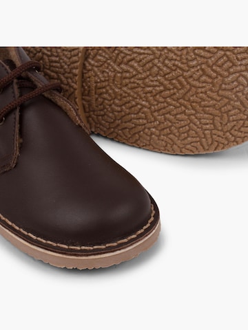 Pisamonas - Botas en marrón