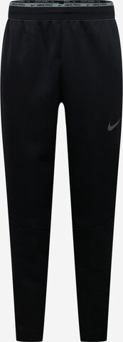 NIKE Tapered Workout Pants in Black: front