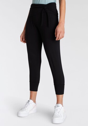 FAYN SPORTS Tapered Sporthose in Schwarz