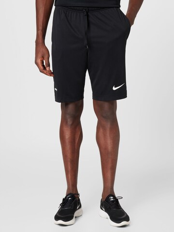 NIKE Regular Workout Pants in Black: front