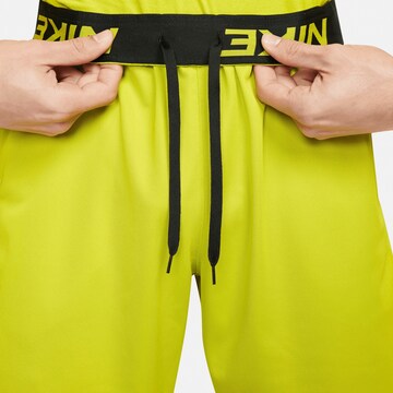 NIKE Regular Workout Pants 'Totality Pro' in Yellow