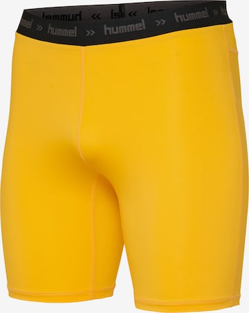 Hummel - Skinny Pantalón deportivo en amarillo