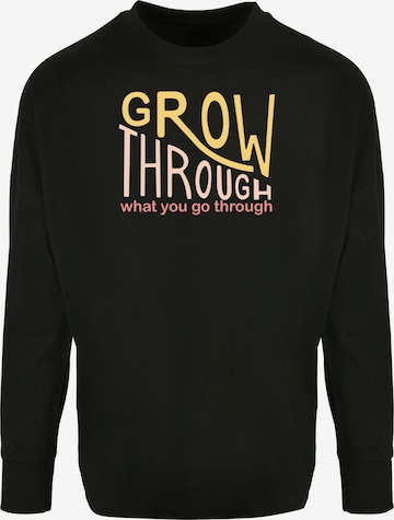 Merchcode Shirt 'Spring - Grow Through 2' in Black: front