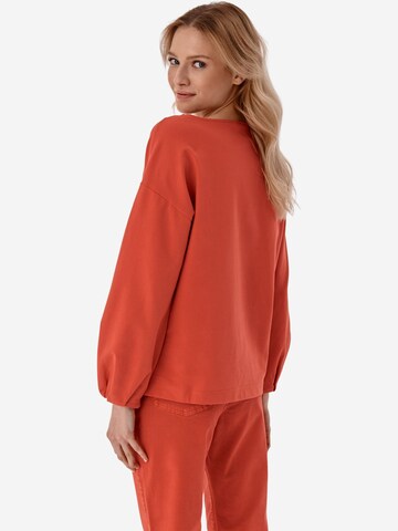 TATUUM Sweatshirt 'SUBMISA' in Oranje